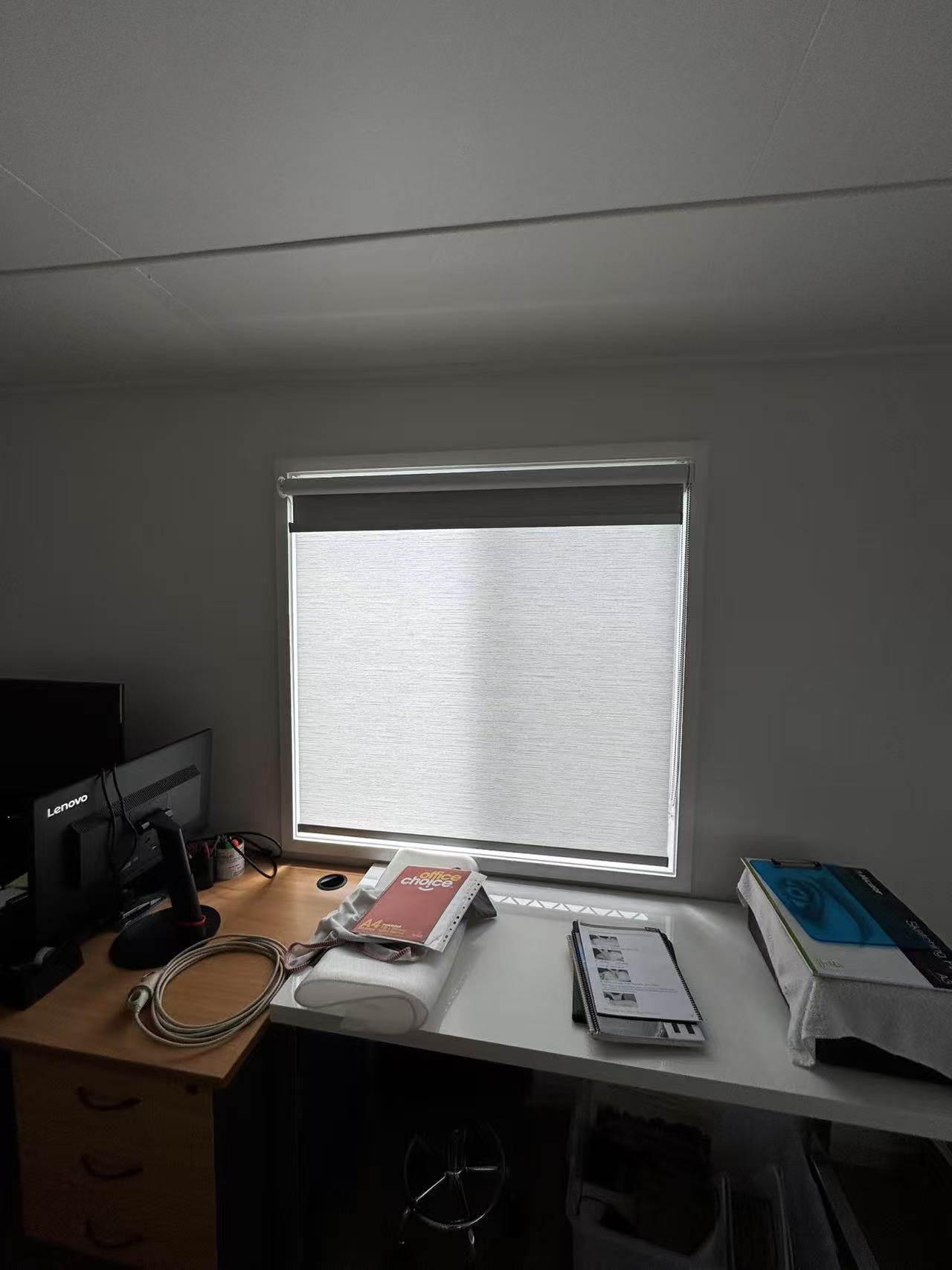 Double roller blind installed for window in the study room