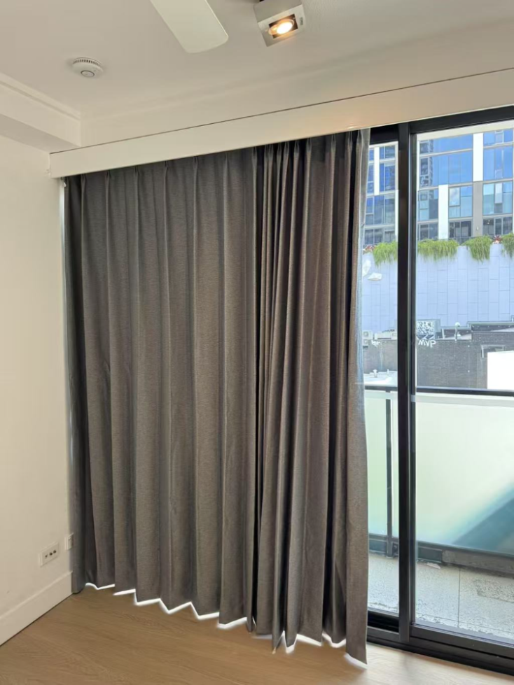Mid grey blockout curtain installed for sliding door