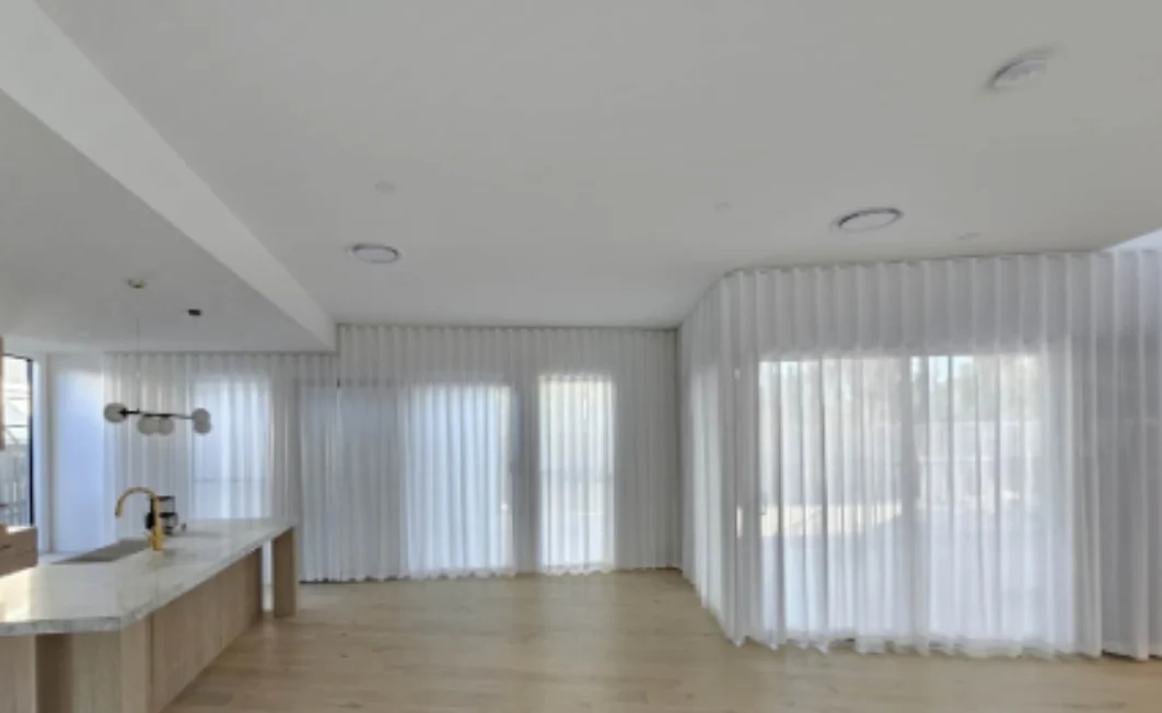 S-Fold transparent sheer installed for sliding doors and windows in kitchen and living area