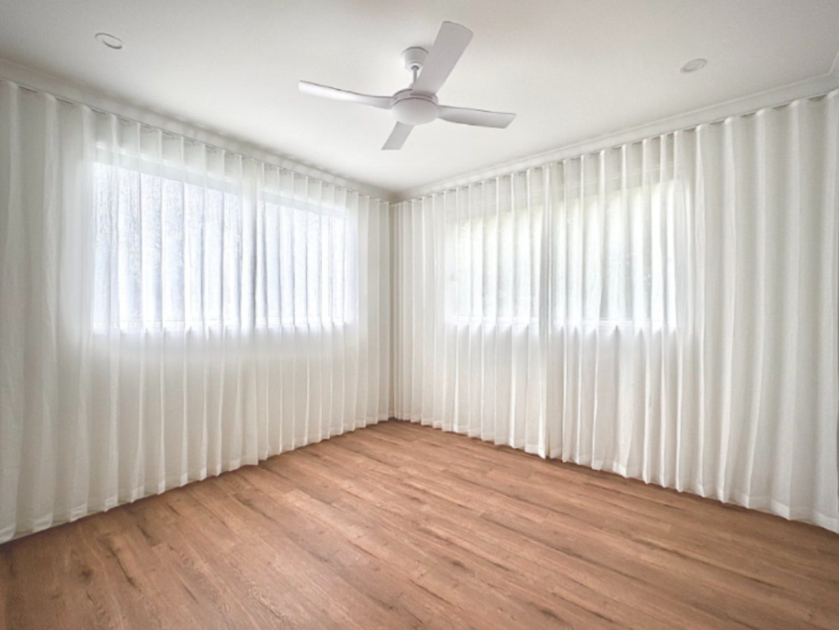 S-Fold transparent sheer installed full wall size for two windows in bedroom