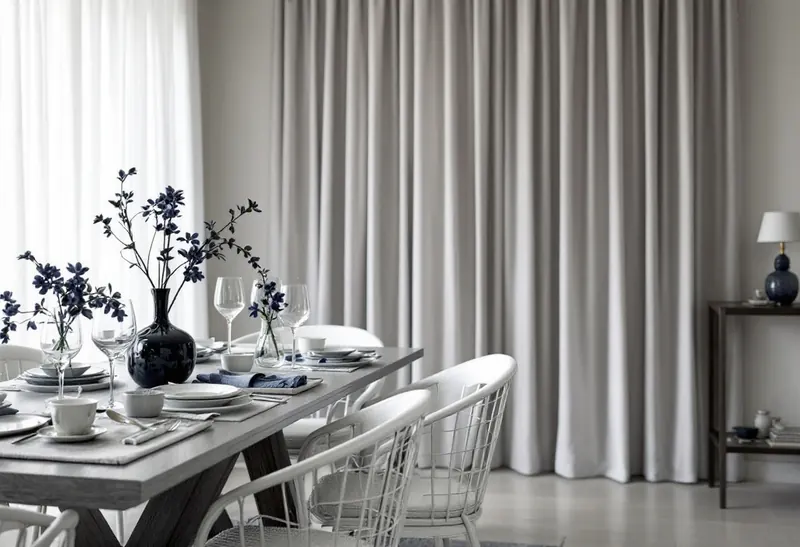 Sheer and blockout curtains layered on the same window for day and night